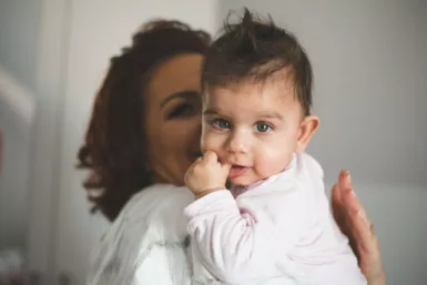 a person holding a baby