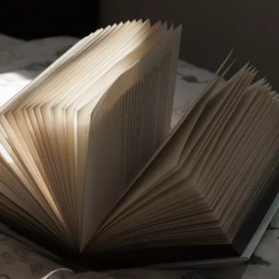 white book on black textile